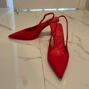 Red pointed toe heels
